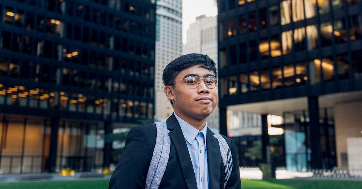 Student dressed in a suit in the financial district