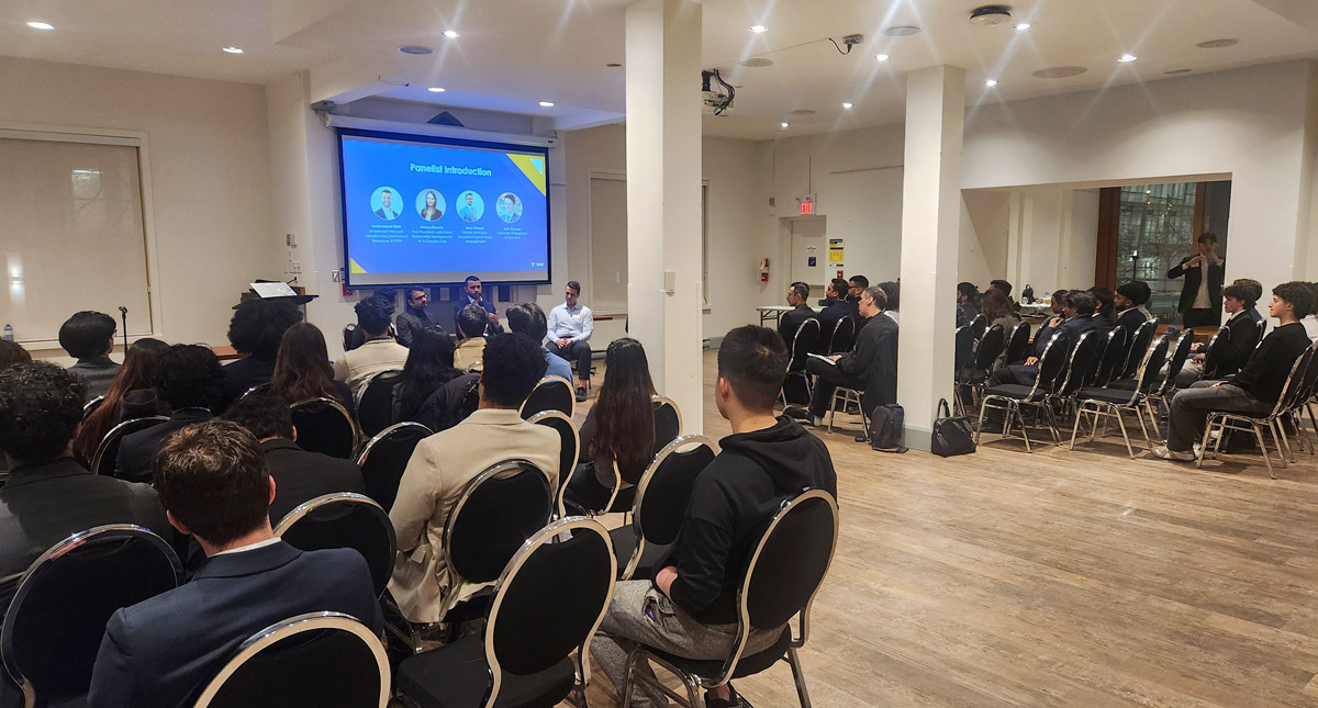 School of Accounting and Finance's information sessions with a photo of panel members from TRAIC and students seating around them, listening and engaged