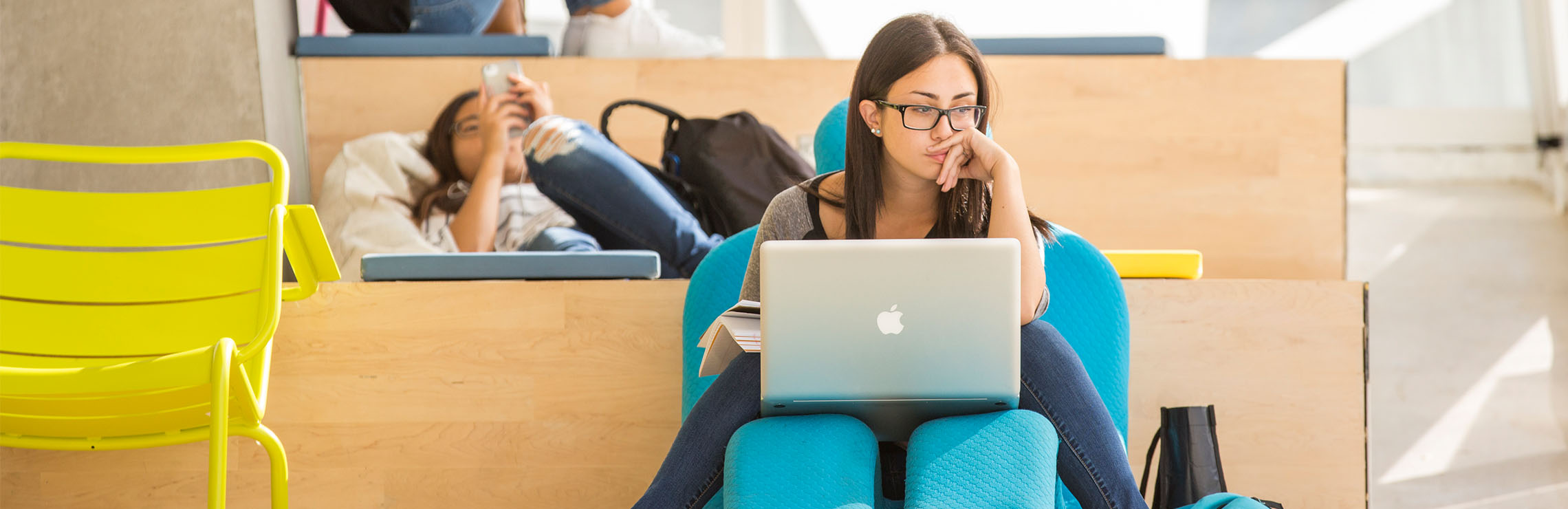 Person sitting with laptop.