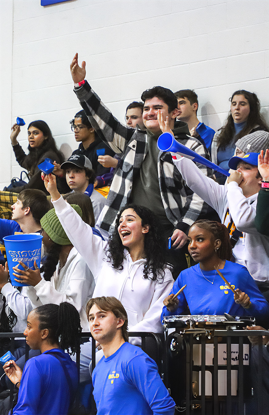 A crowd of students cheering and celebrating