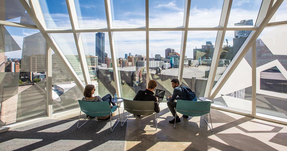 Students sitting by window in Student Learning Centre