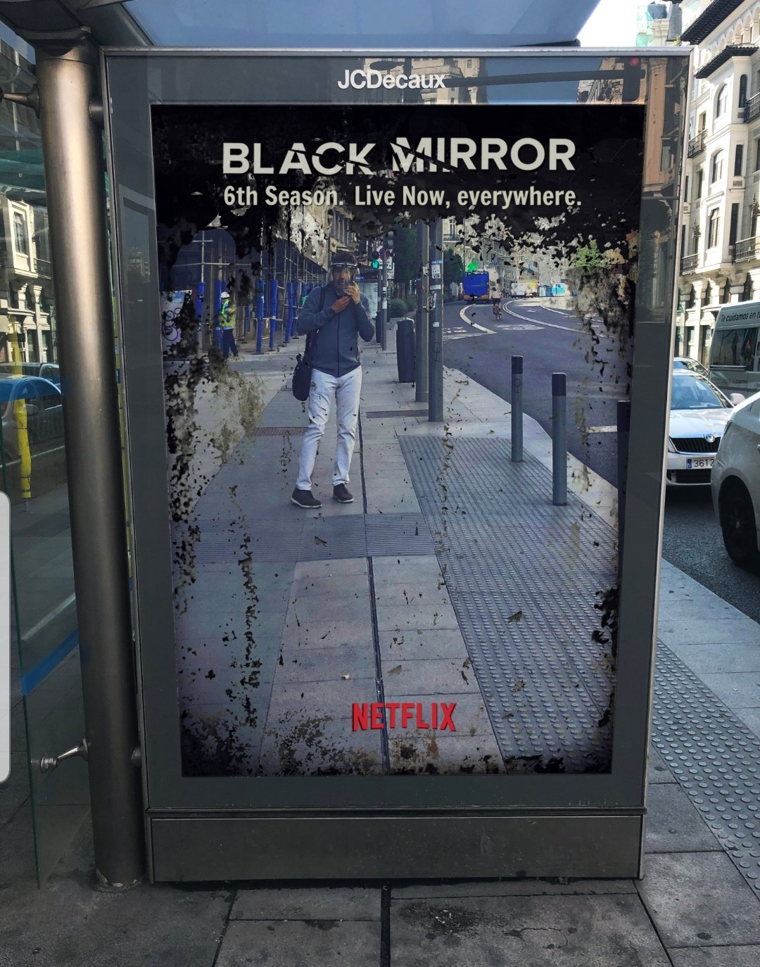 Photo of a Black Mirror TV Show advertisment on a bus shelter 
