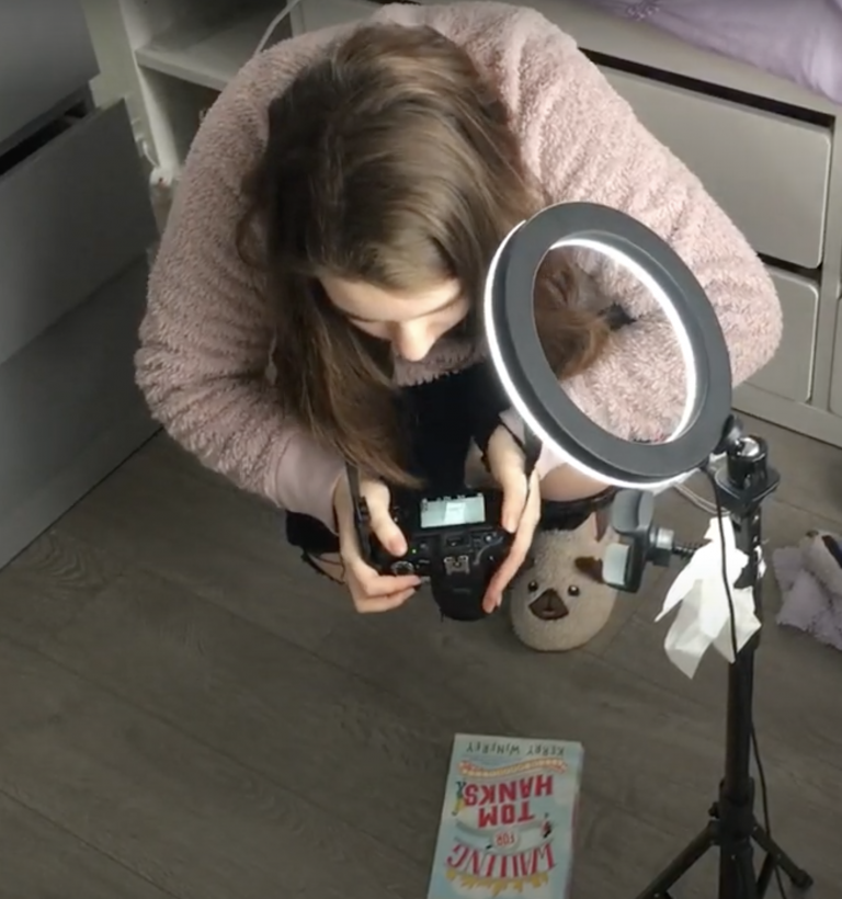 Jenna taking some stock photos of the book she is working on