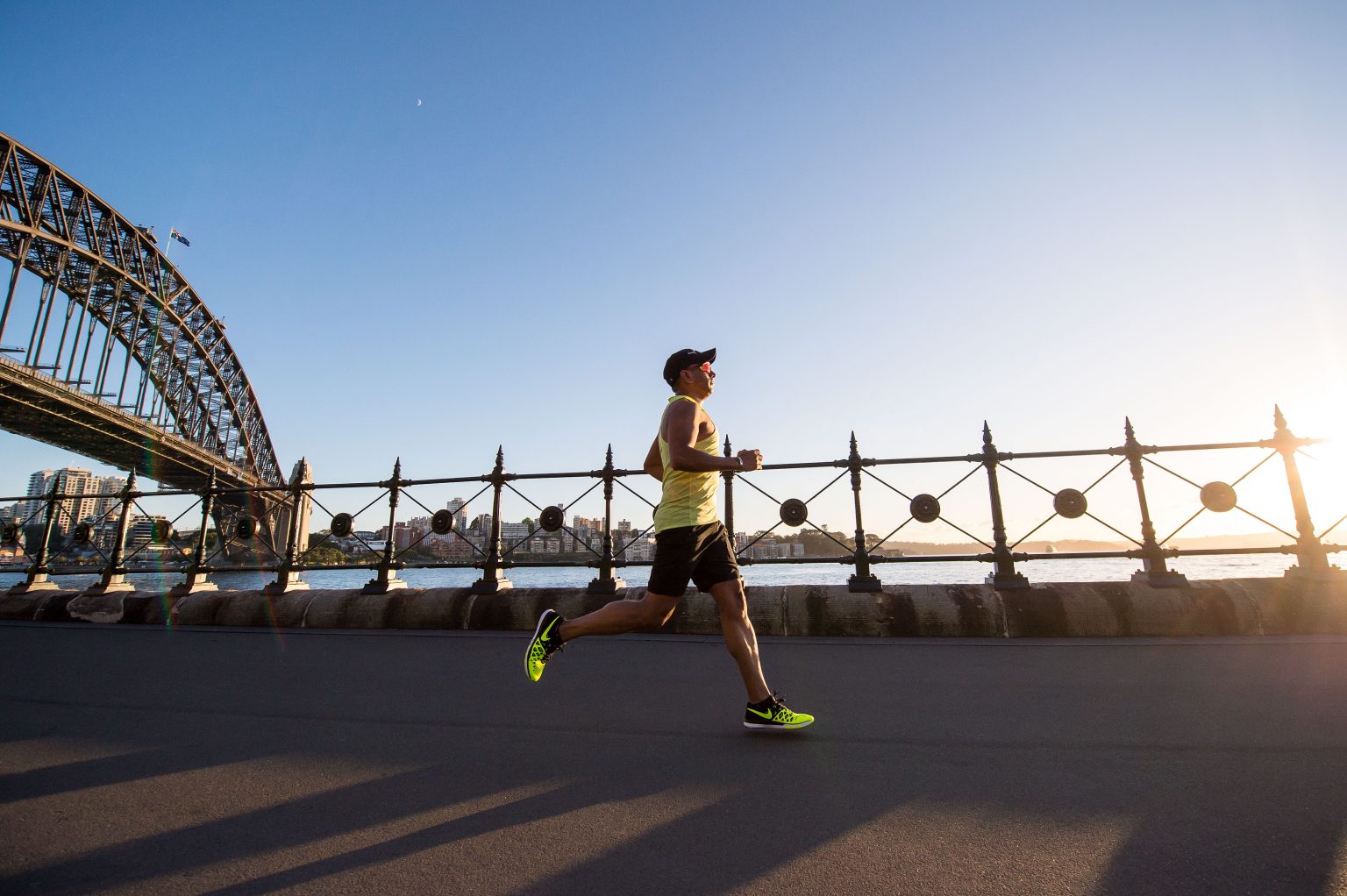 Person running in athletic attire near a bridge somehwere in New York