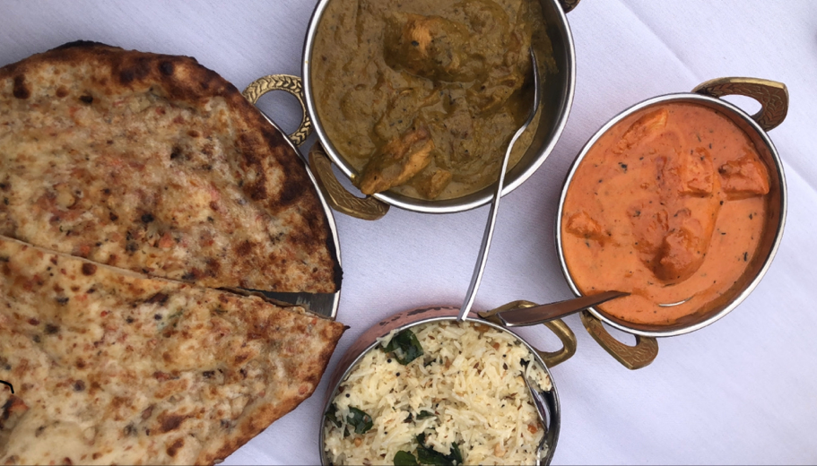 Indian dishes of naan, rice and curry