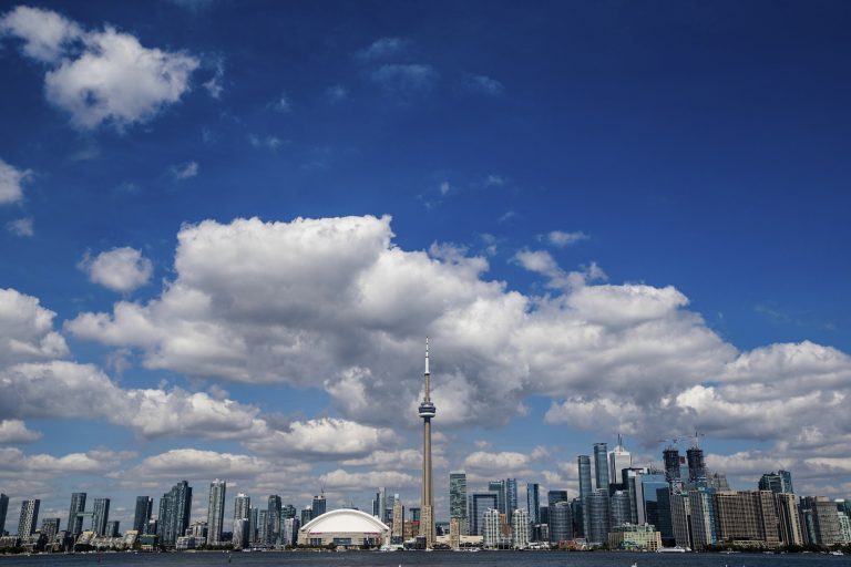 Toronto Skyline by the waterfront on a beautiful sunny and cloudy day