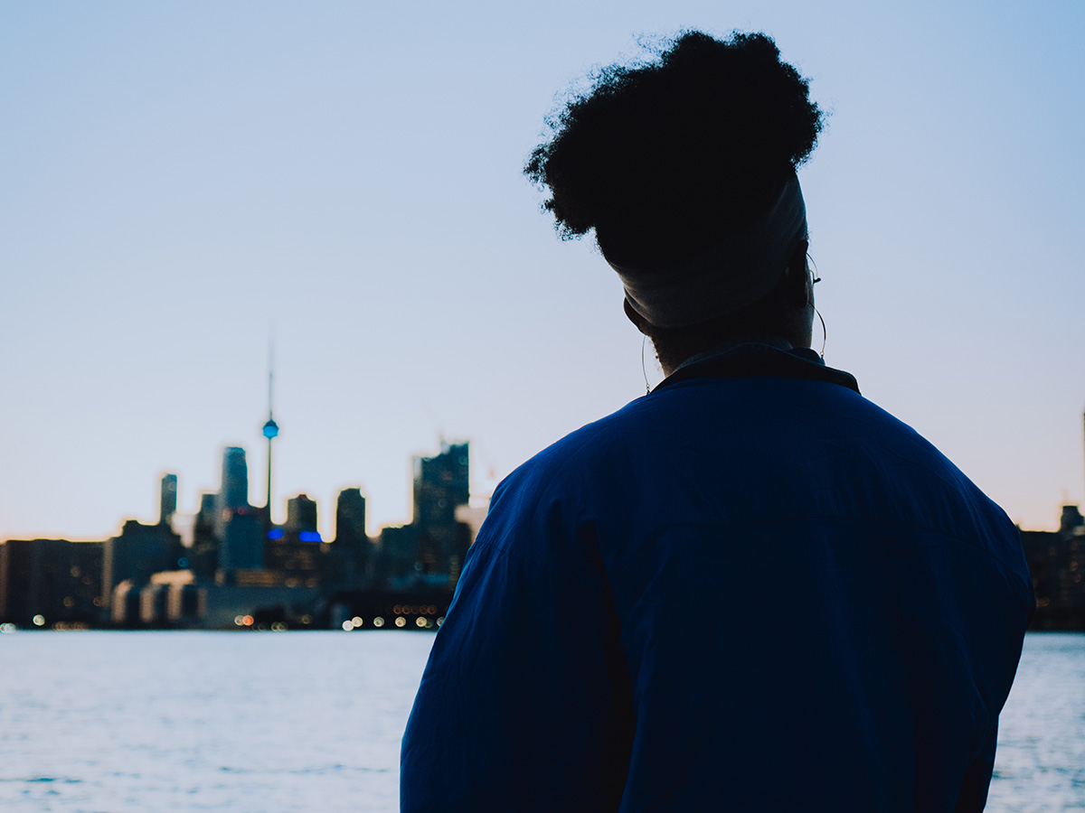 Geneva faces the Toronto skyline as the sun sets.