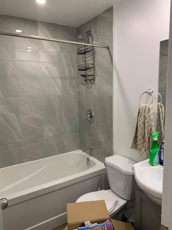 Inside of a bathroom showcasing cleaning products and organization tools.