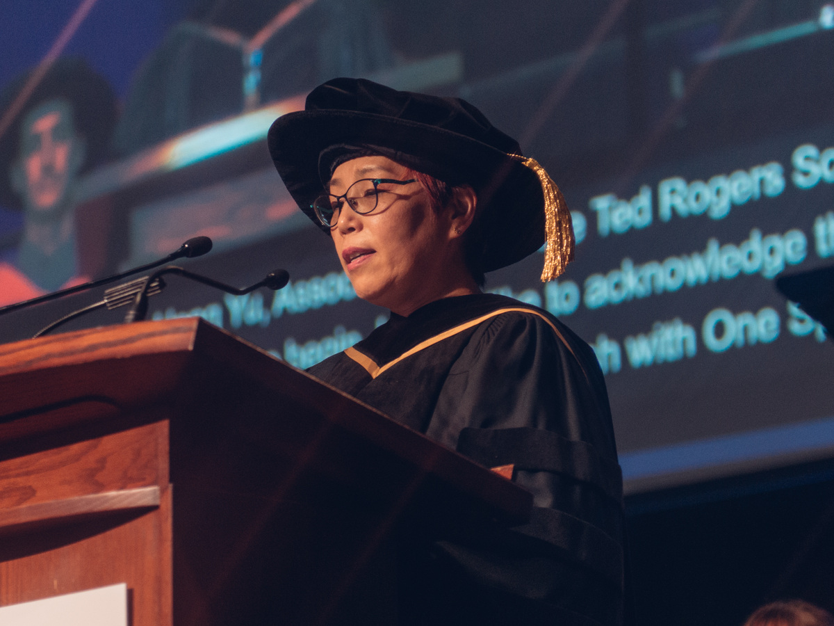 A speaker at Convocation addresses graduates from TRSM