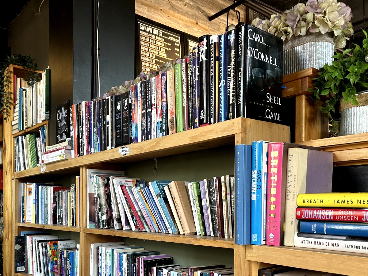 Hundreds of books lay scattered on the shelves of the earthy café, Covernotes Coffeehouse.