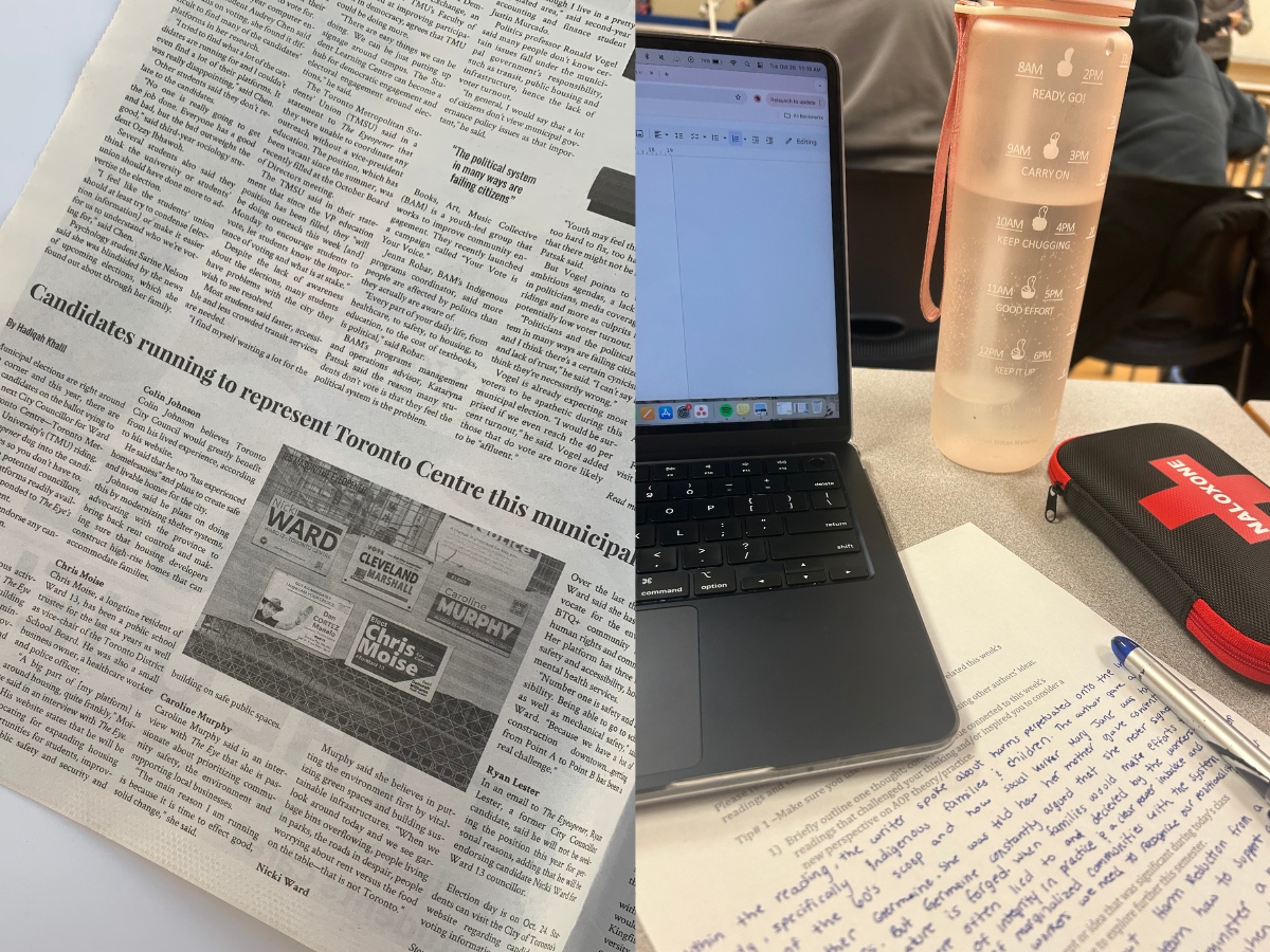 A newspaper lays on the left side, while an emergency kit, notes and a laptop are arranged on the right side of a school desk.