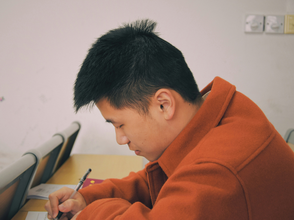 A student writing an exam.