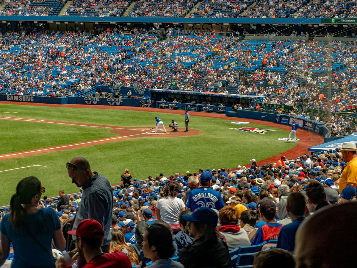 A baseball stadium packed with fans watching the Blue Jays.