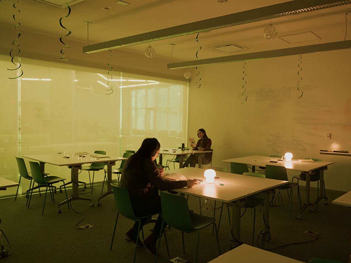 Students read at tables in the Low-Sensory Student Lounge in the Student Learning Centre.