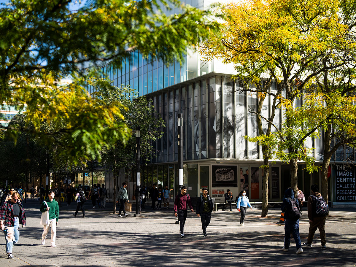 Students walk on Gould Street in front of the Image Centre.