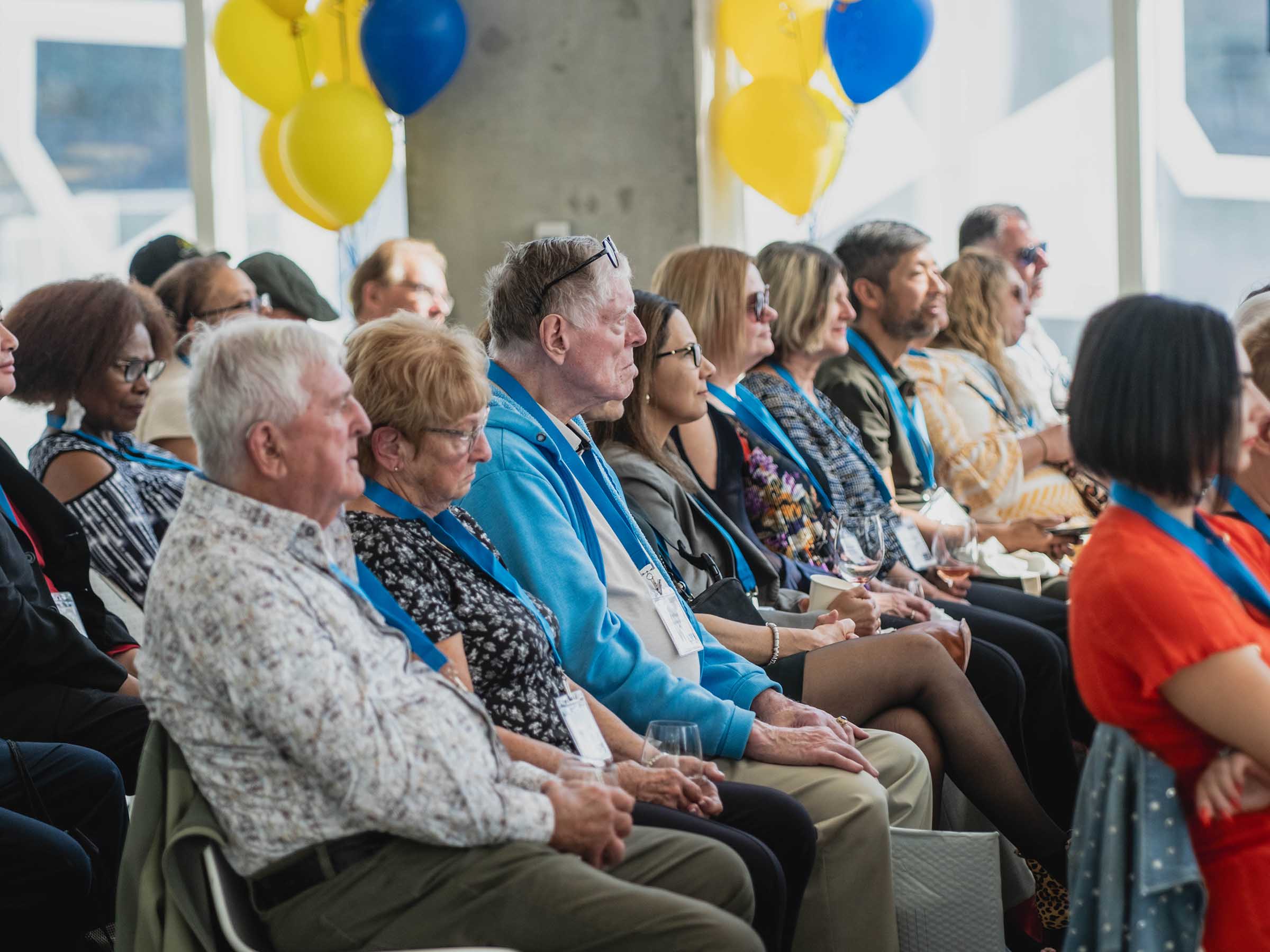 Closeup of audience watching keynote speaker at Alumni Reunion