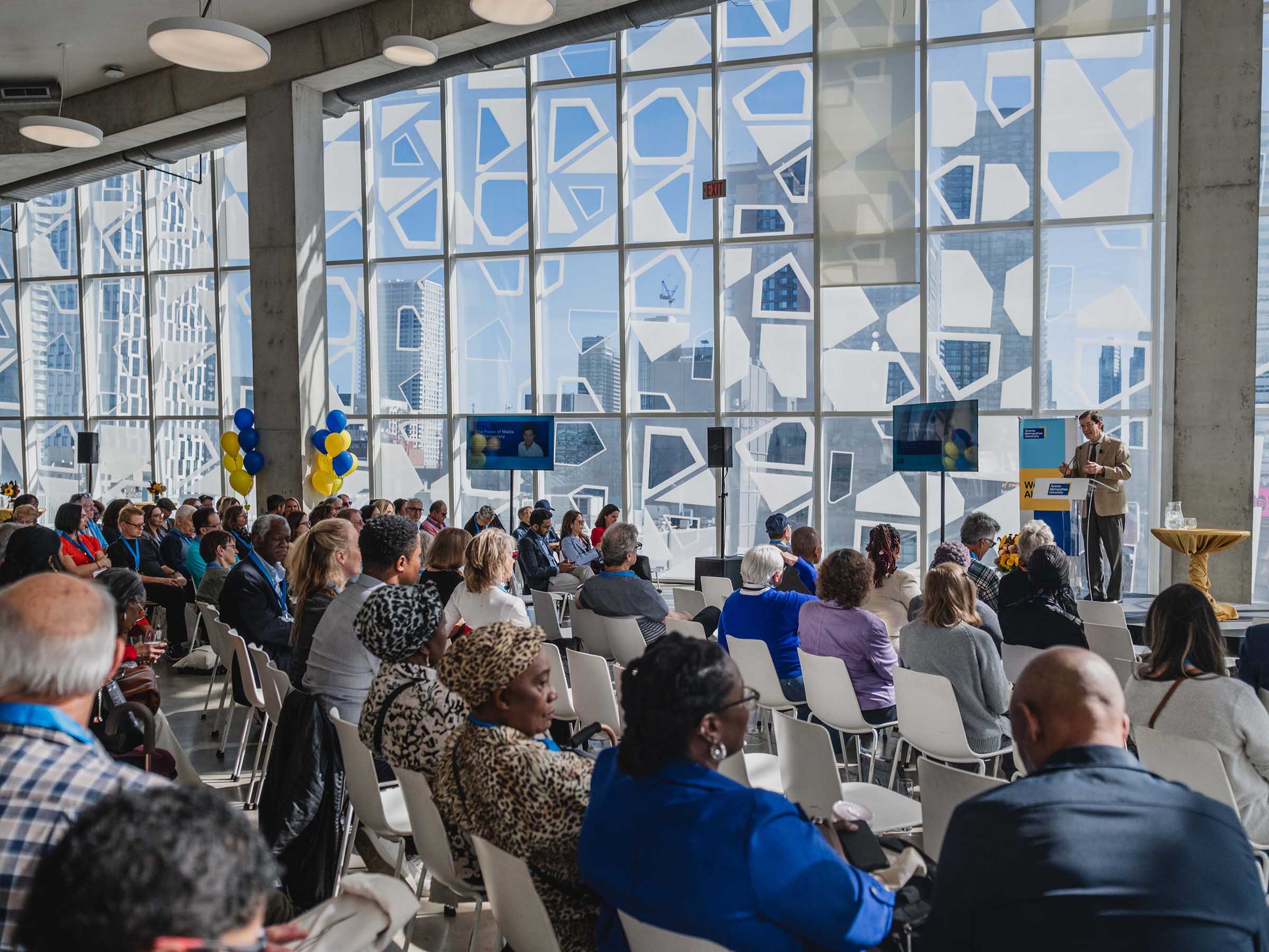 Audience watches Alumni Reunion keynote address in Student Learning Centre