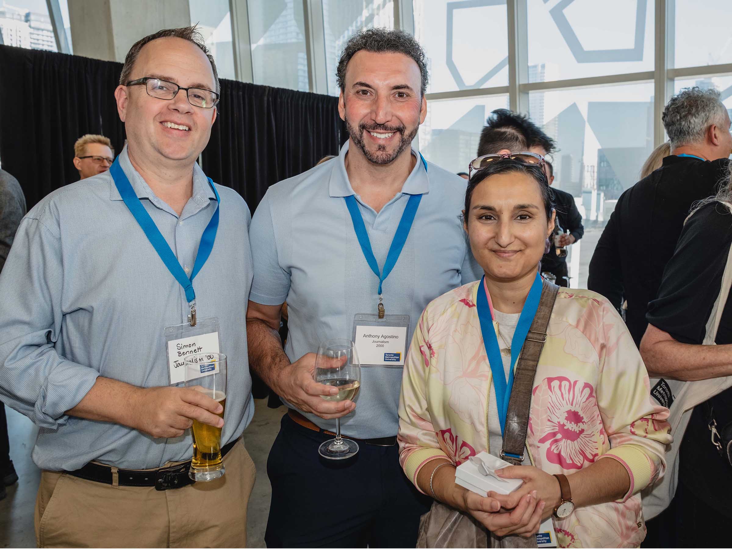 Three happy alumni together during in Alumni Reunion reception