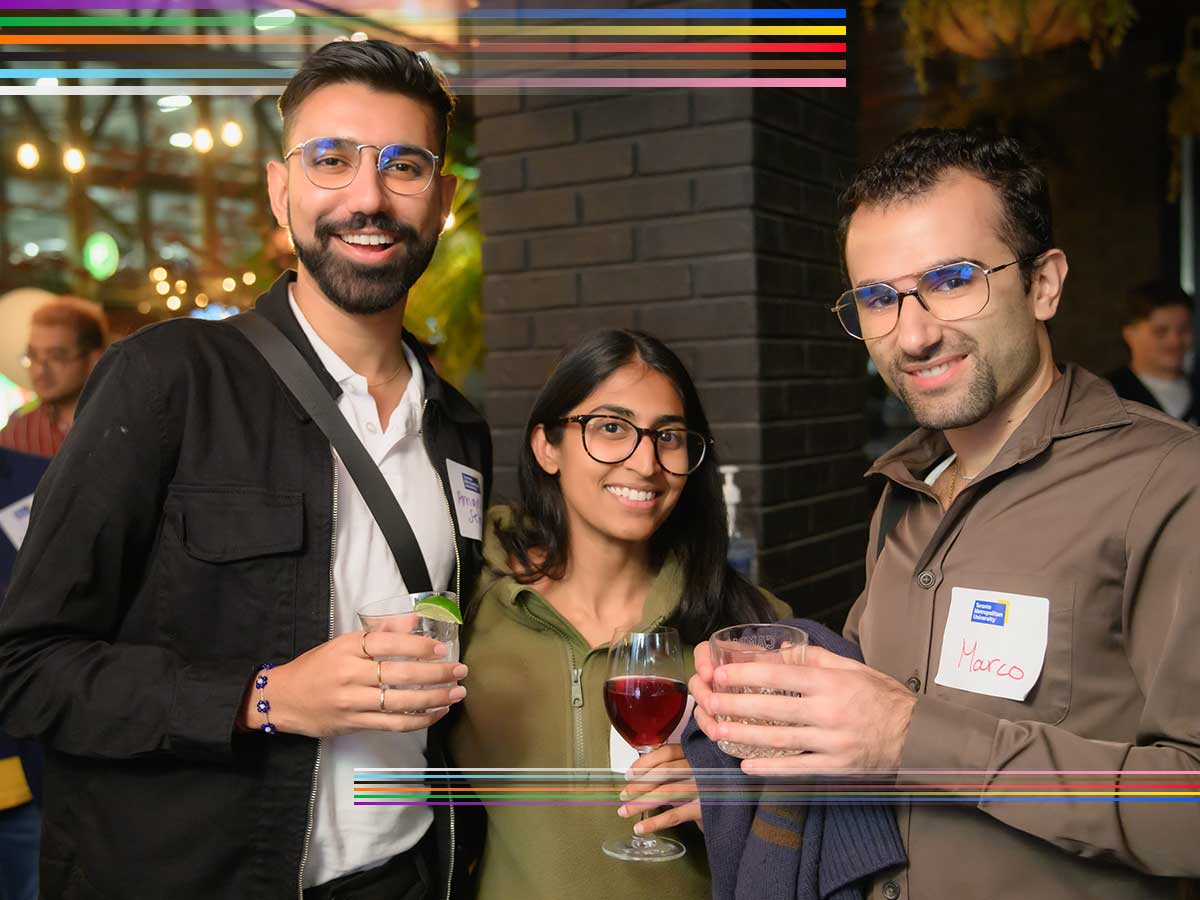 Group of alumni socializing at an event.