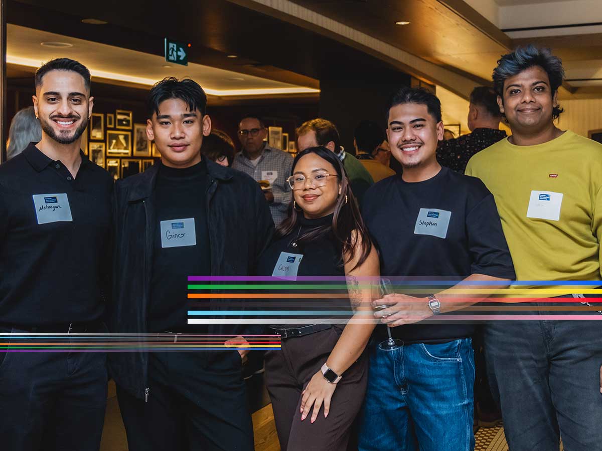Group of alumni socializing at an event.