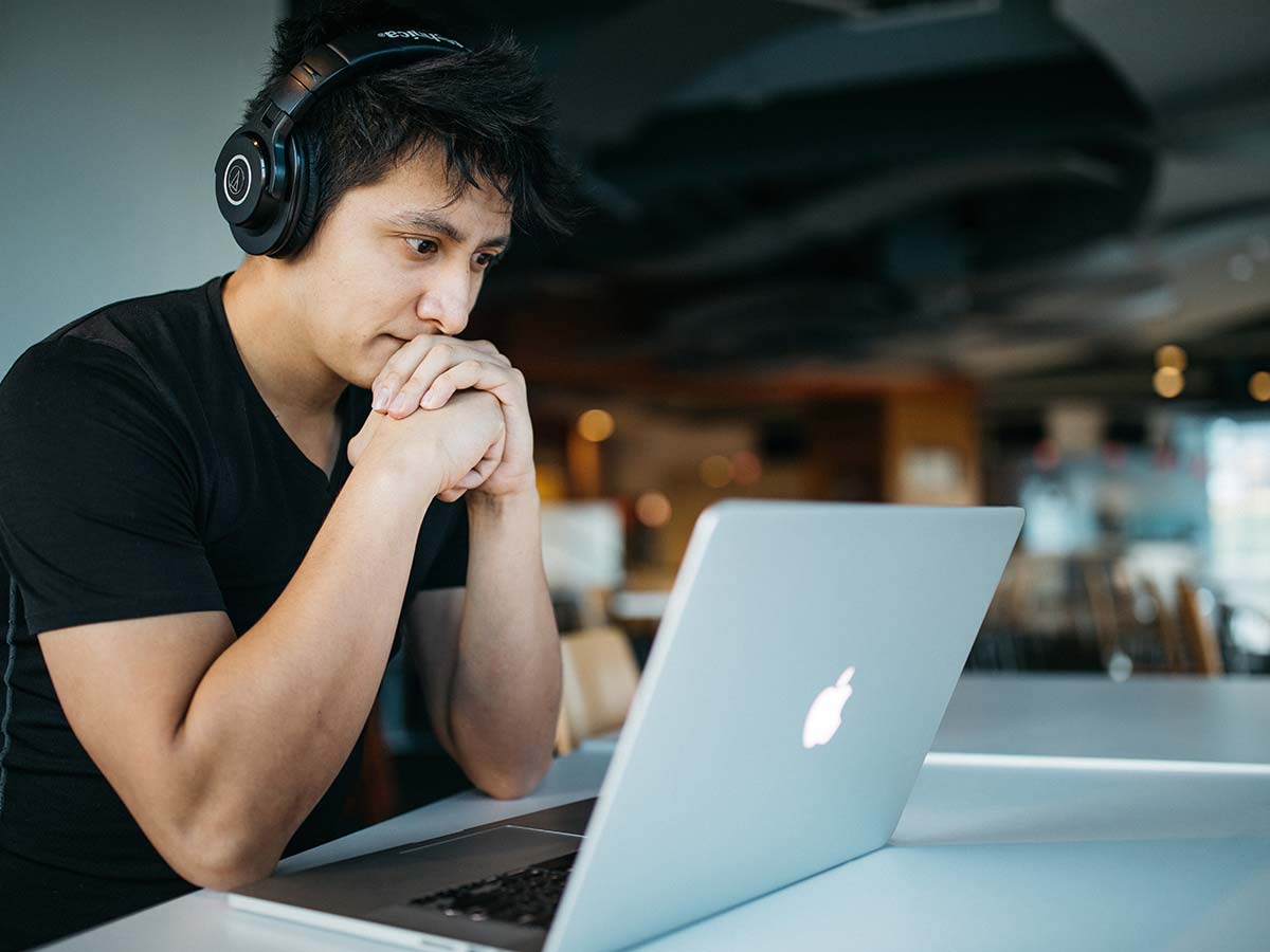 Person looking at a laptop. Photo by Wes Hicks on Unsplash.
