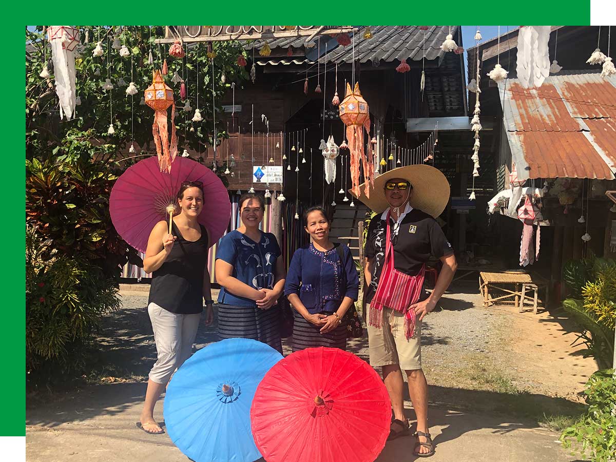 Kelly Galaski (far left) at a women’s handicraft co-op in Northern Thailand on a Planeterra community tourism development trip.