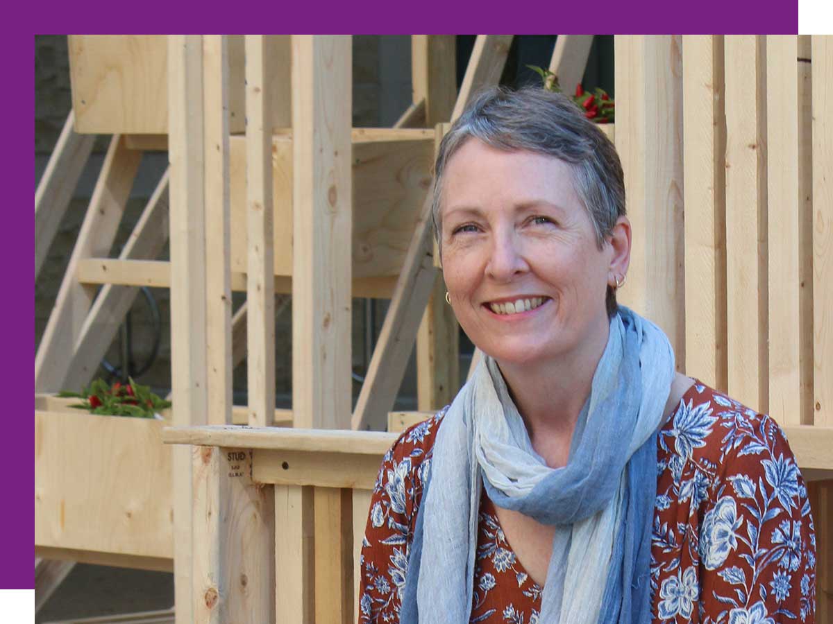 Nicole Blanchett sitting on a wooden structure outside Photo credit:Gary Gould.