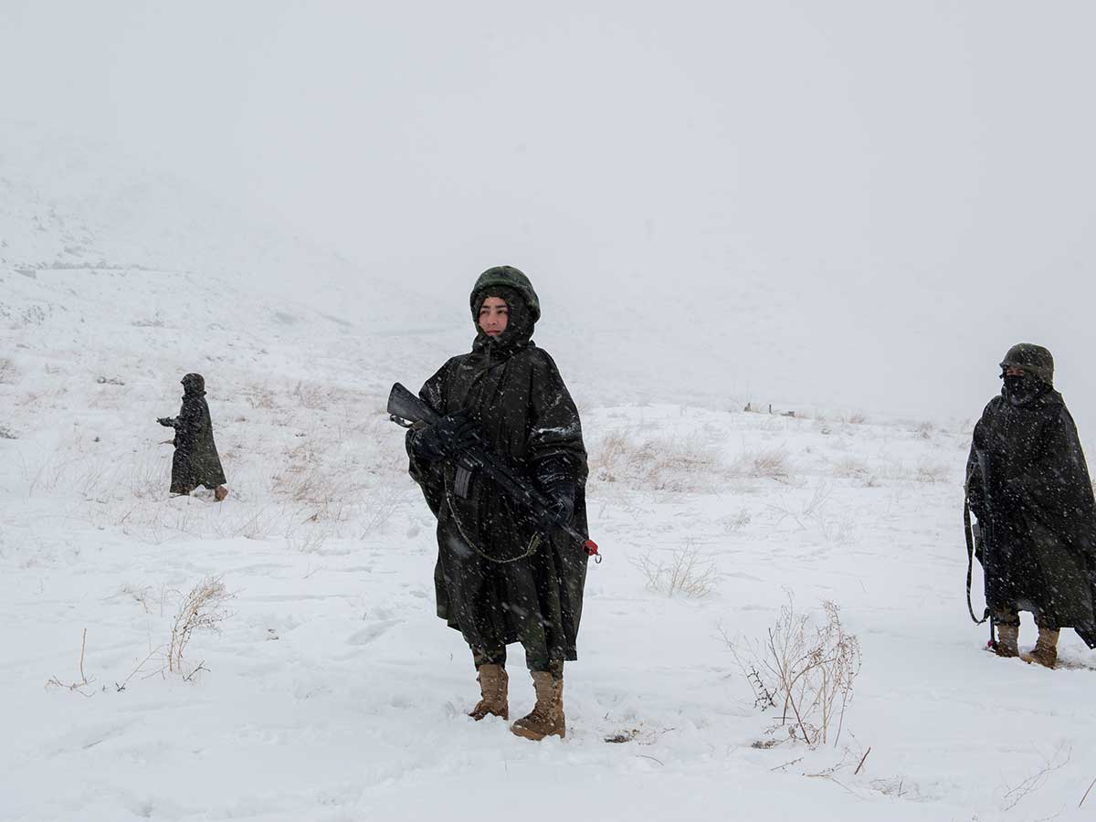 Afghan girls patrol, during an ambush scenario, at Marshal Fahim Qasim Military Academy, north-west of Kabul. February 20, 2019. Photo by Kiana Hayeri