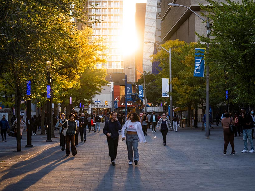Students walking through the TMU campus.