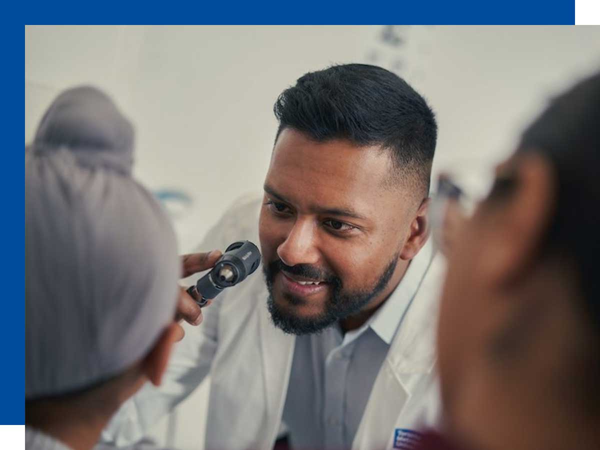 Doctor examines a young patient