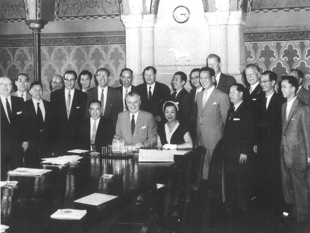 Black and white photo of Jean Lumb with John Diefenbaker and delegation