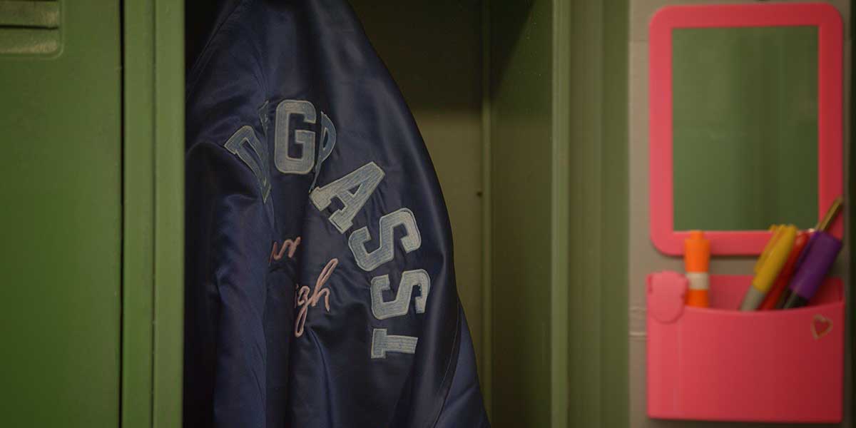 Film still of a Degrassi varsity jacket hanging inside a locker