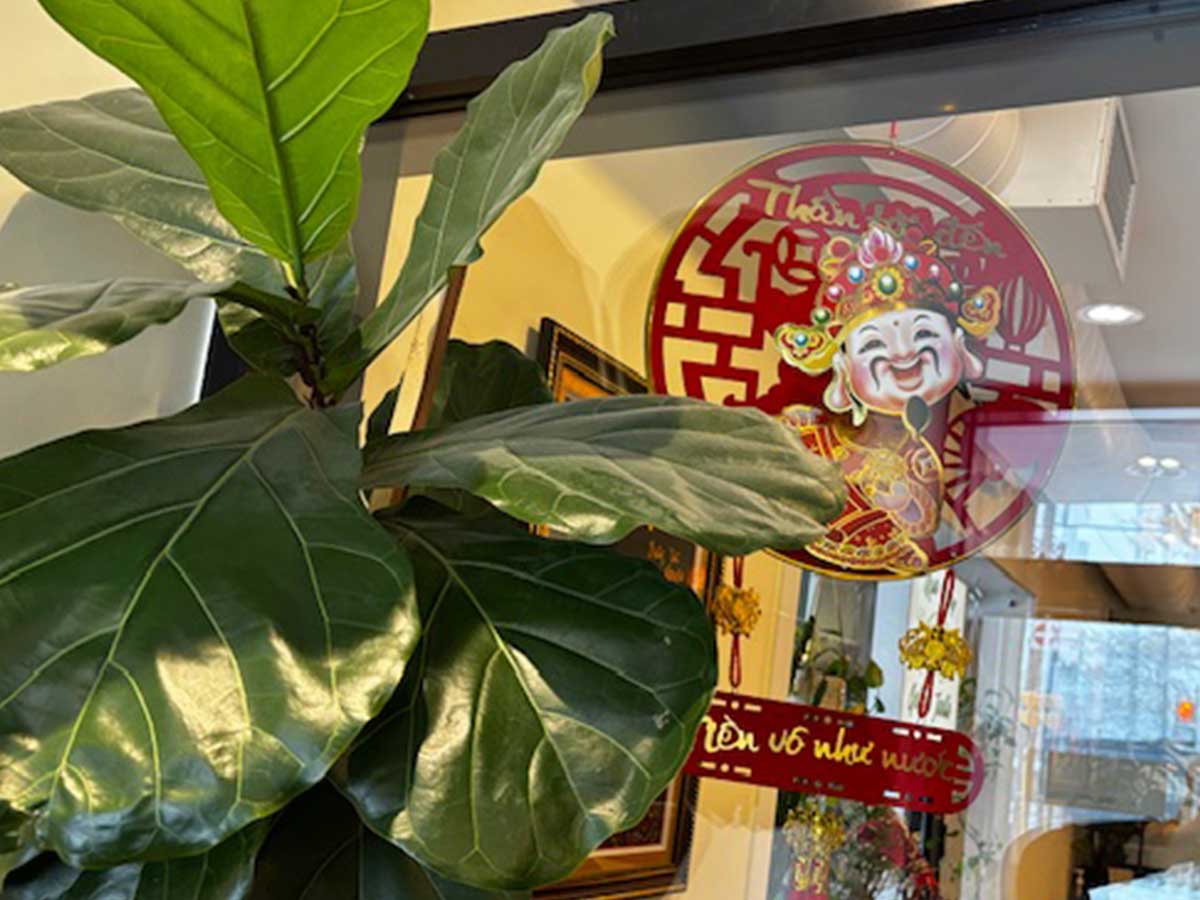 Lunar New Year decorations hanging inside of a restaurant