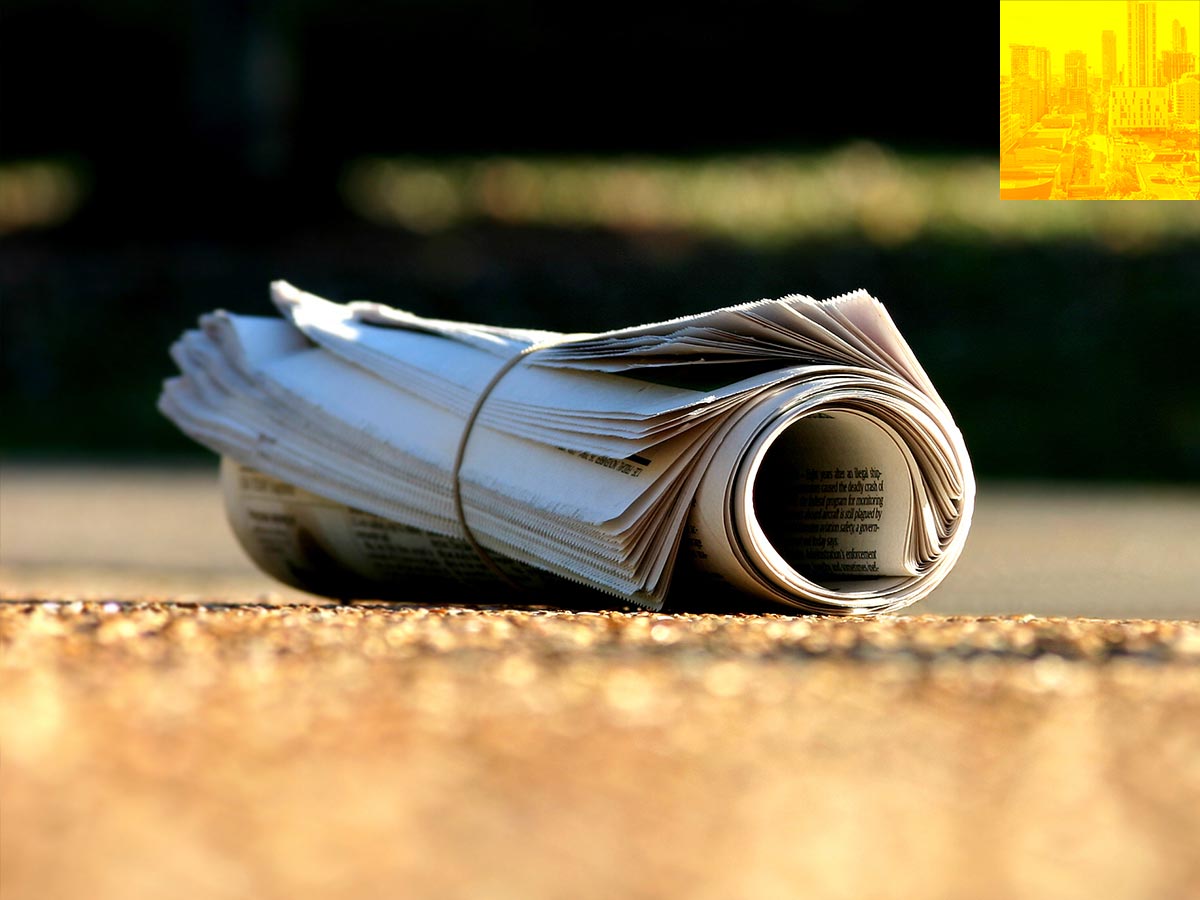 Newspaper rolled up and tied with an elastic.