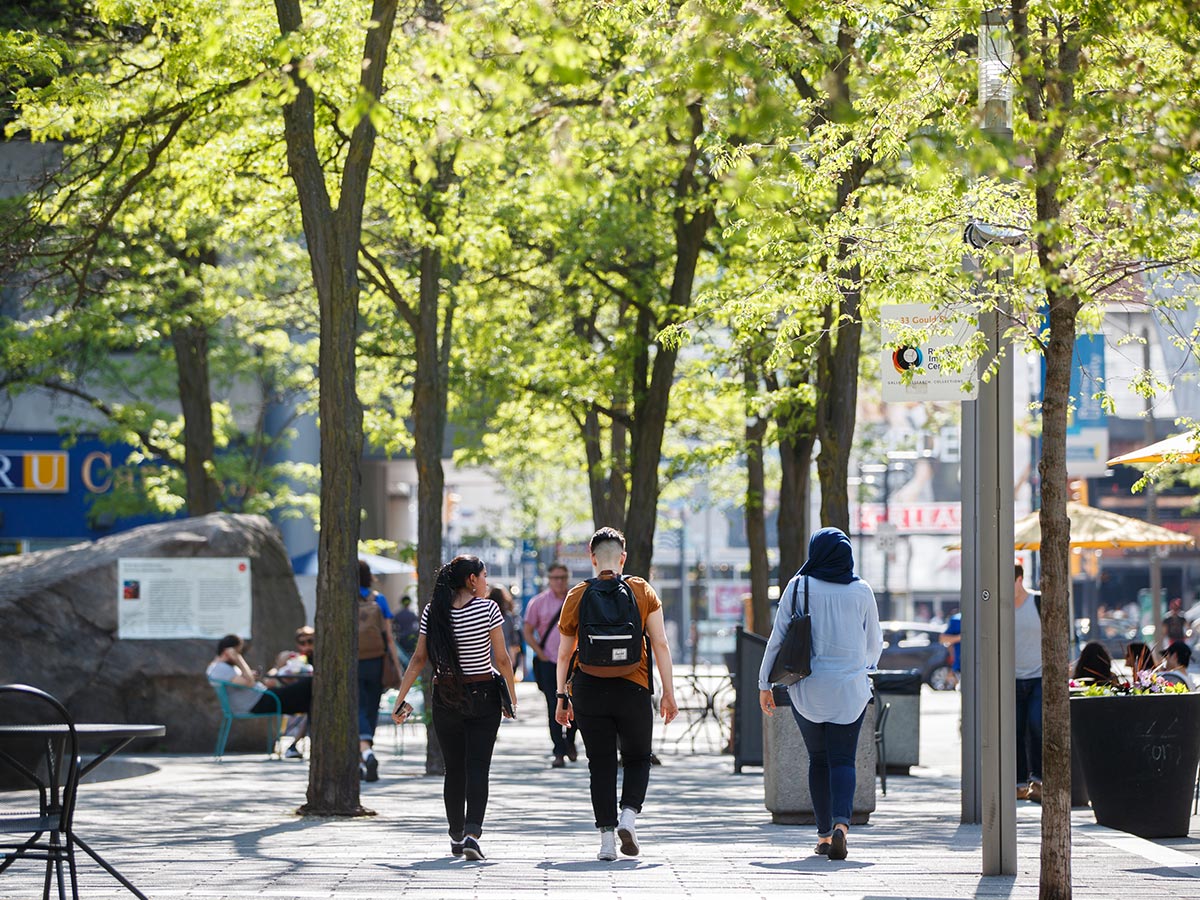 Students walk along Gould St.