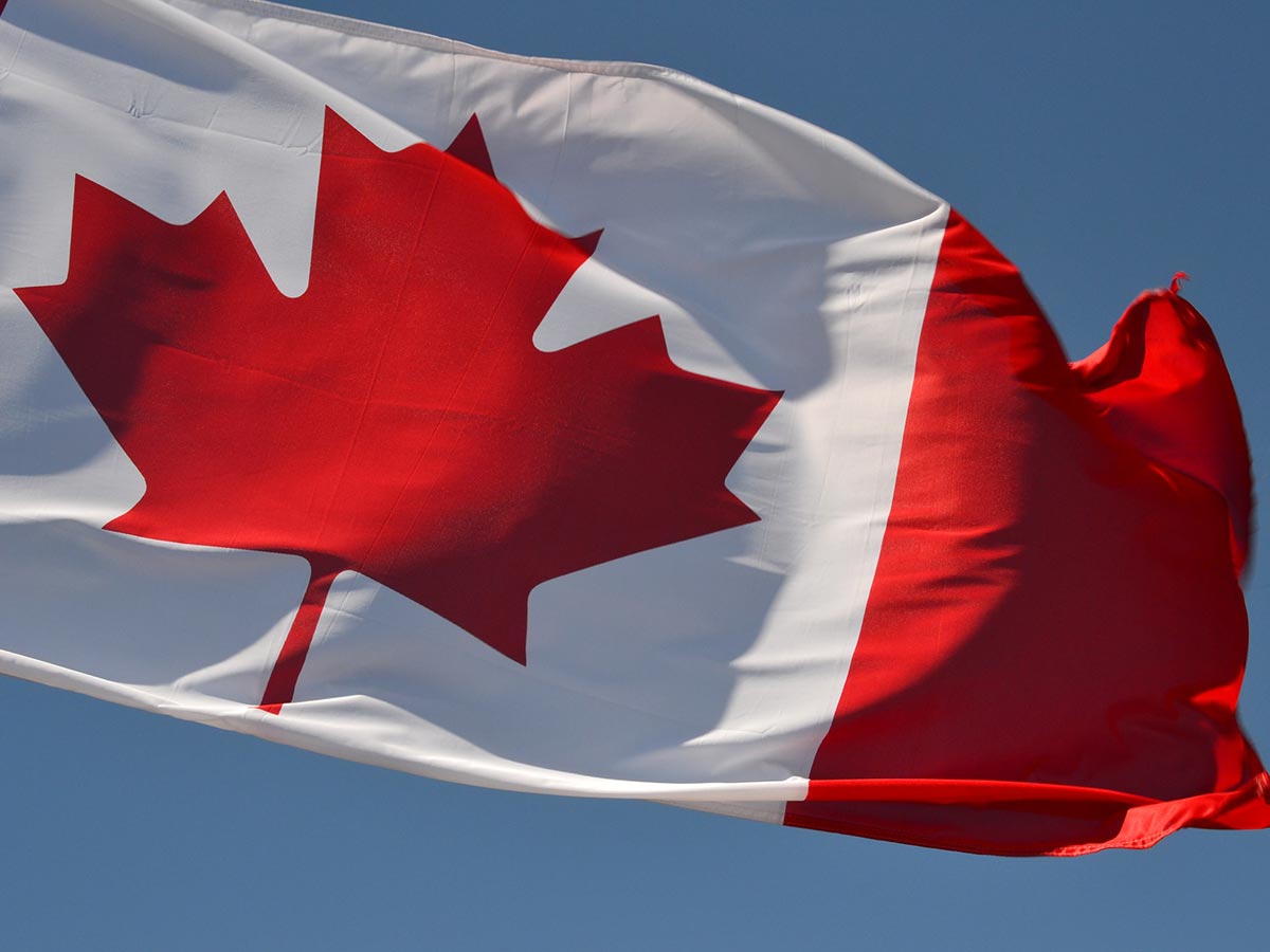 The Canadian flag flapping in the wind
