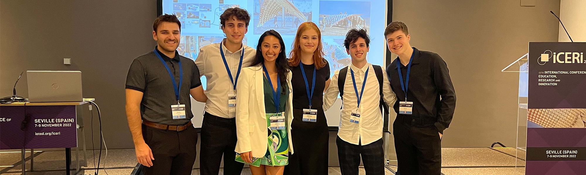 Cropped image of undergraduate students Ariel Weiss, Jake Levy, Jake Kroft, Luke De Bartolo, Sadberk Agma, and Daniela Diaz presenting at the International Conference of Education, Research and Innovation.