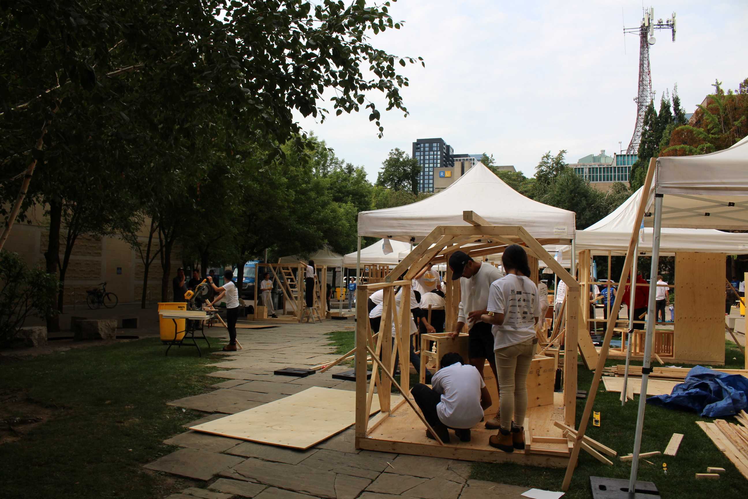 A wide-shot featuring students working on their Community Garden Pavilions. 