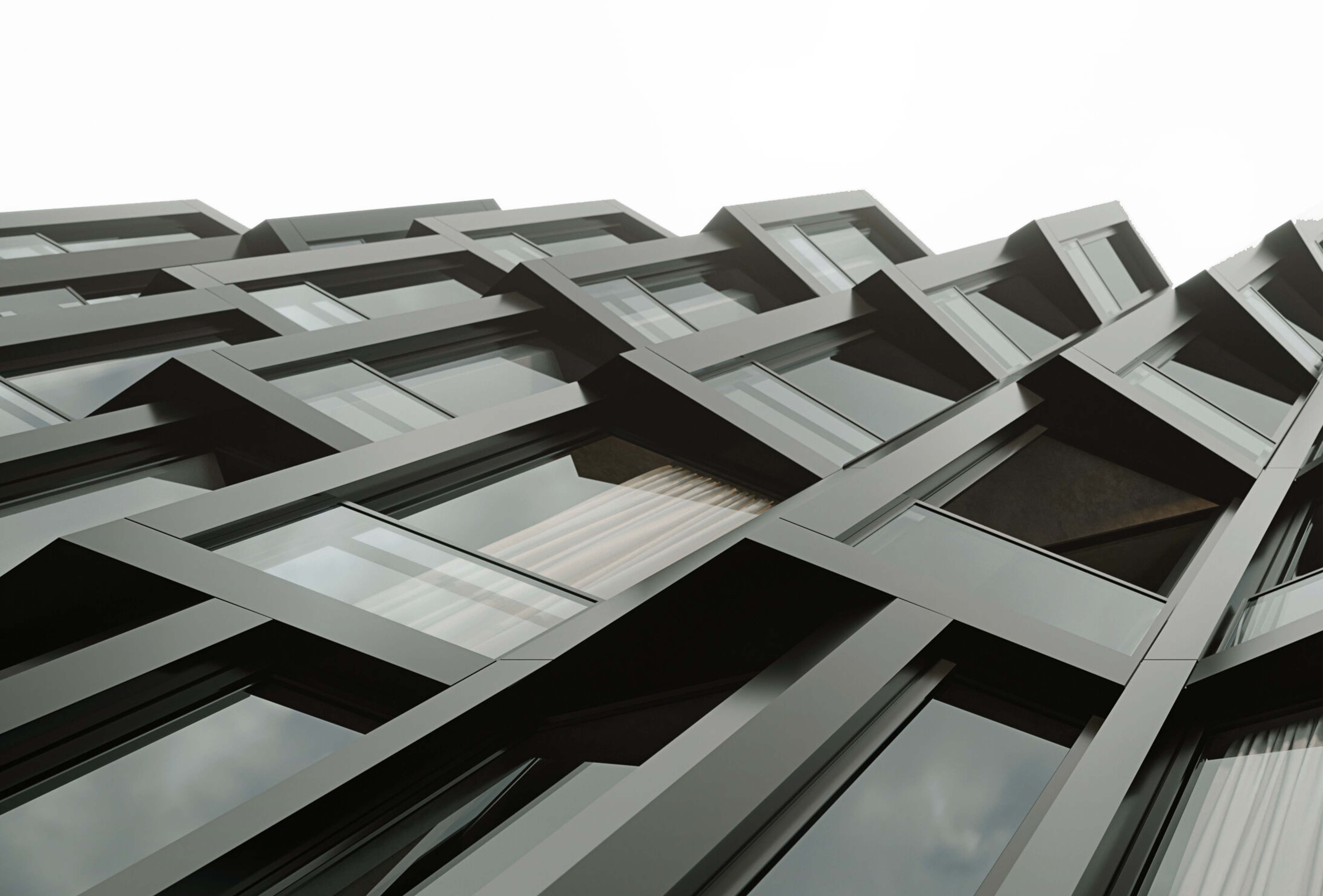 Close-up shot of the angular windows of a residential tower in Haarlem, formerly the Fluor office building. Photograph courtesy of Elephant. 
