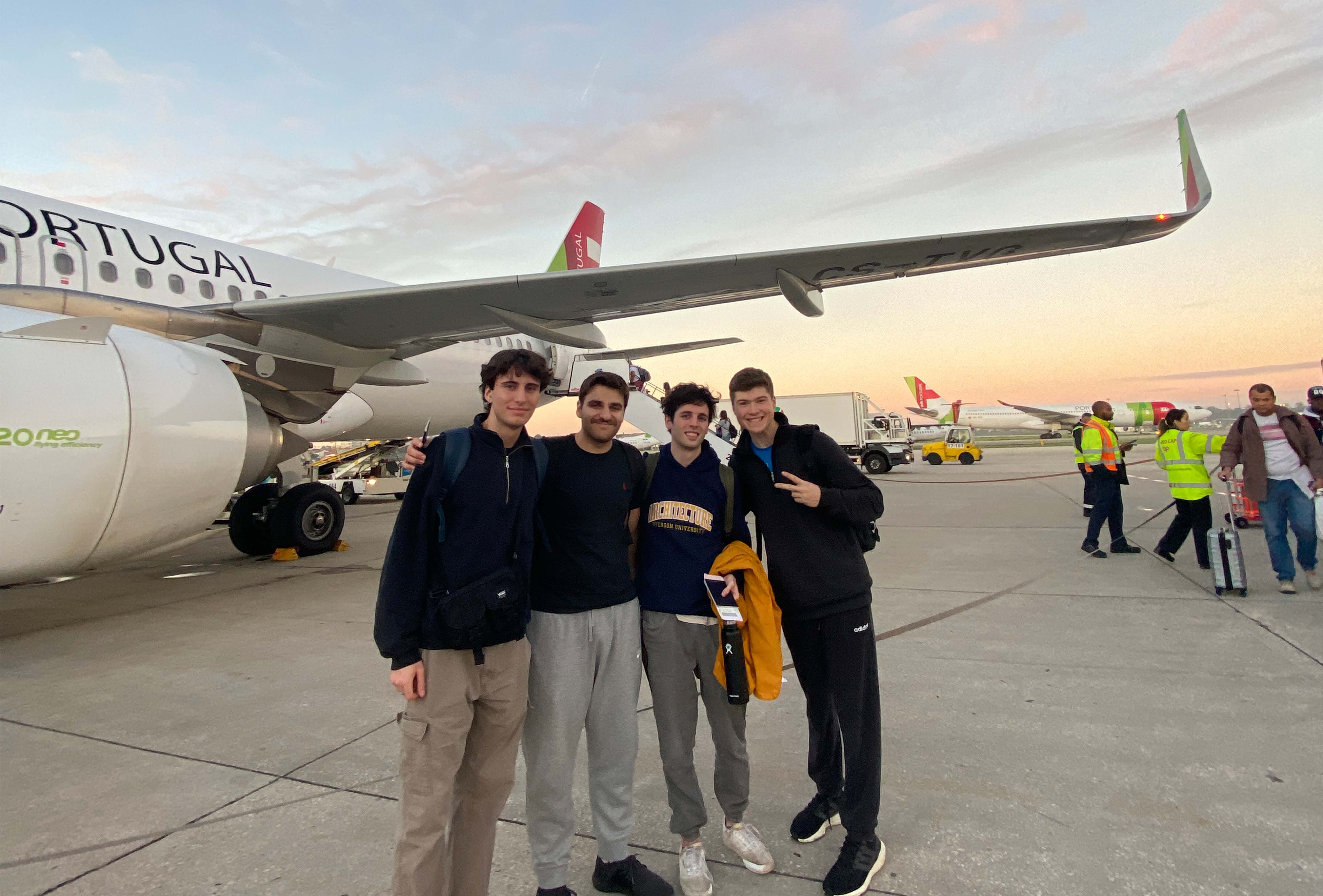 Undergraduate students Ariel Weiss, Jake Levy, Jake Kroft, and Luke De Bartolo posing in front of a plane.