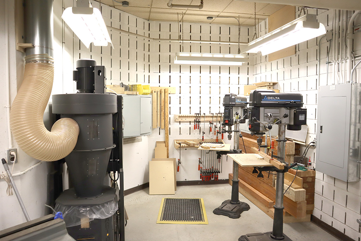 Two drill presses and other equipment located in the Woodshop. 