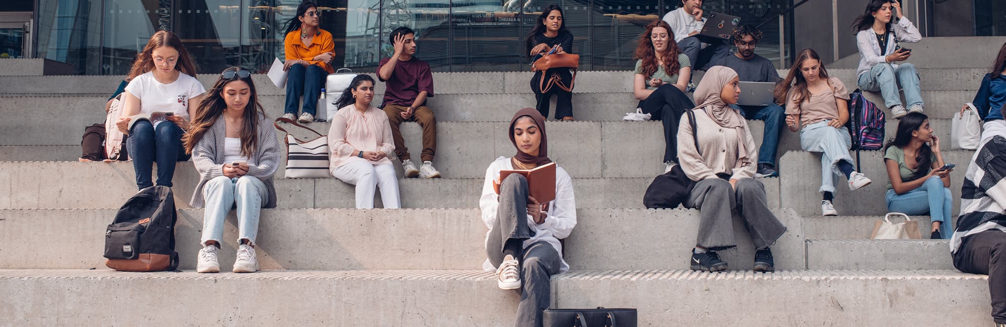 students sitting on steps
