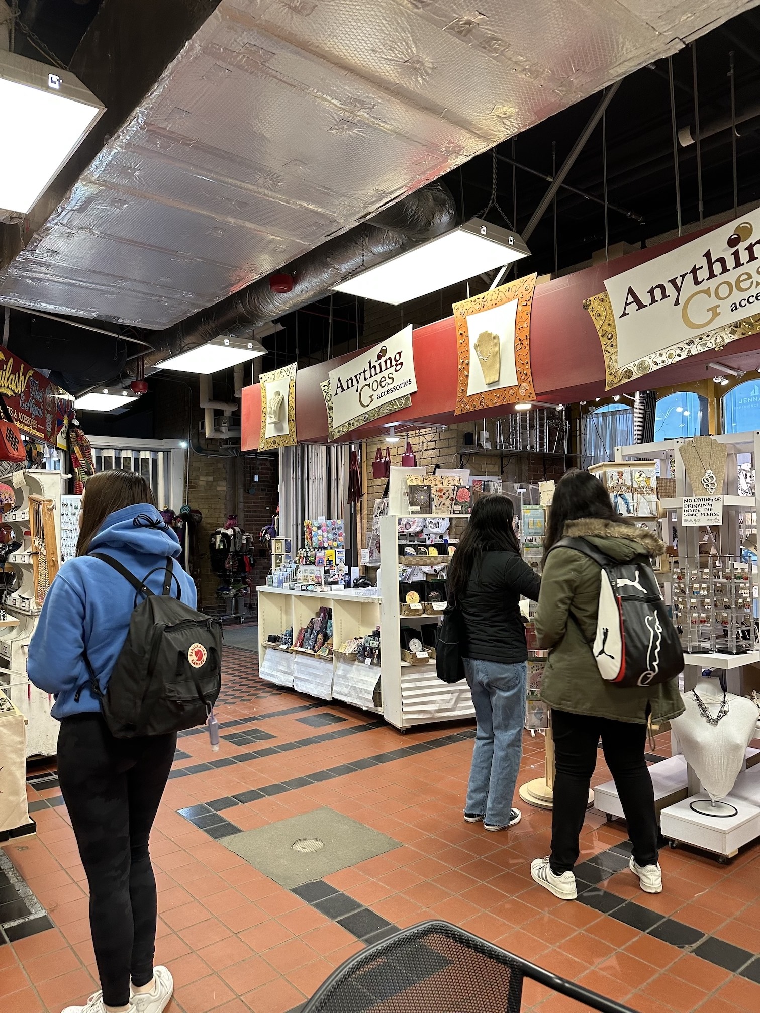 Student's browse a selection of local goods