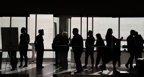 Sillouettes of attendees waiting in anticipation of Blakeley's lecture.