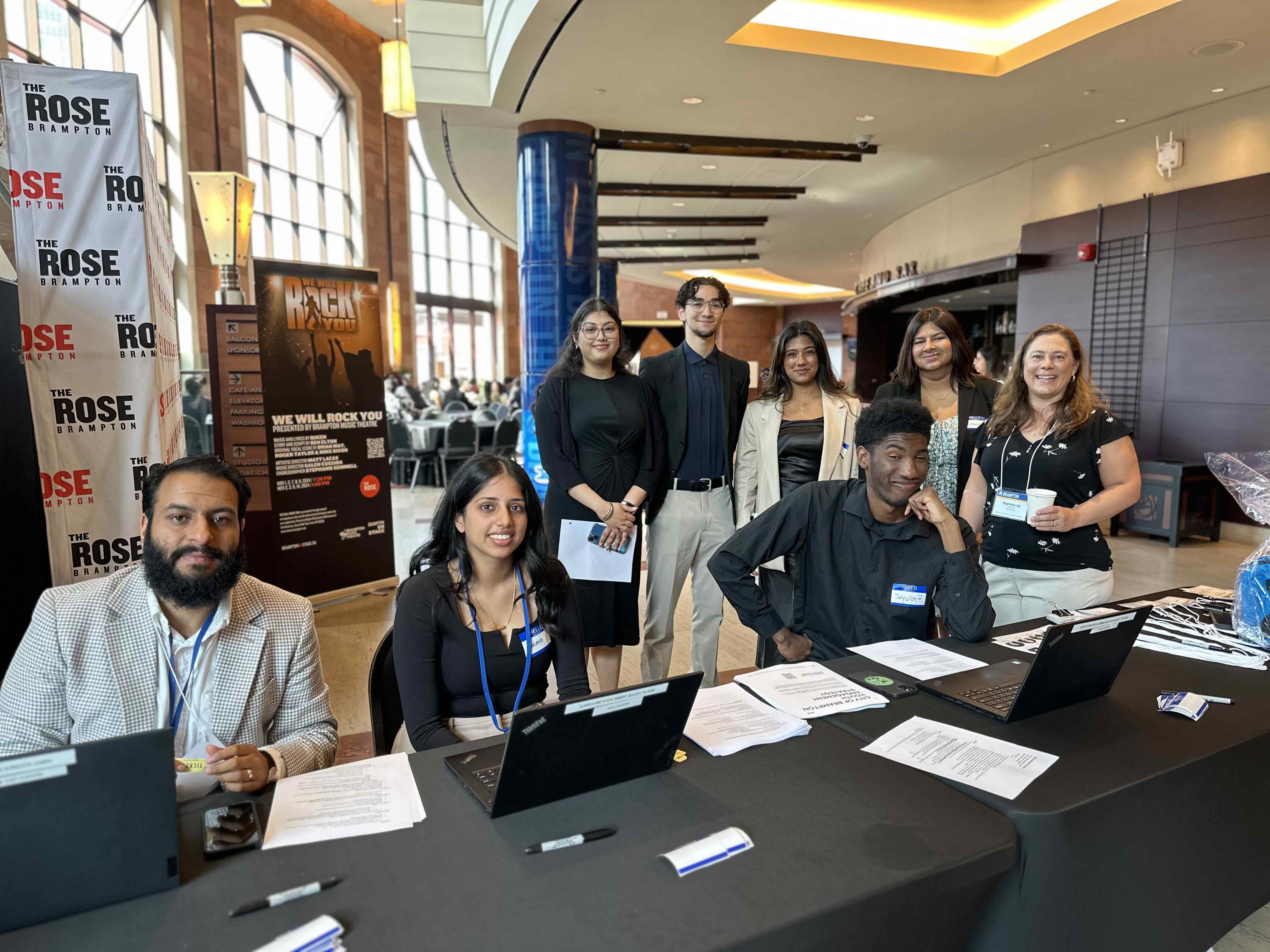 Group photos with City of Brampton colleagues and summer students at an event during Rajneet’s time as a Program Administration Officer. 