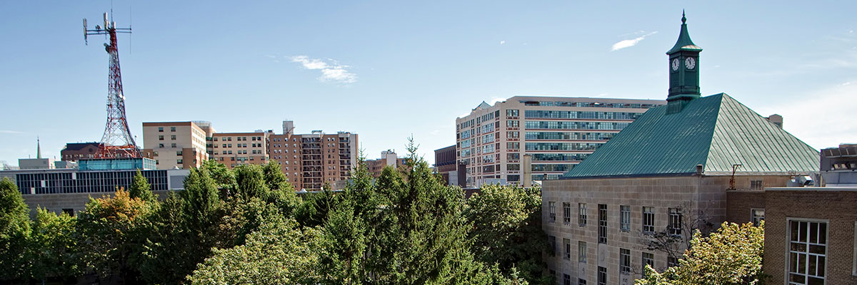 The copper roof of Kerr Hall south and the iconic clocktower on TMU campus.