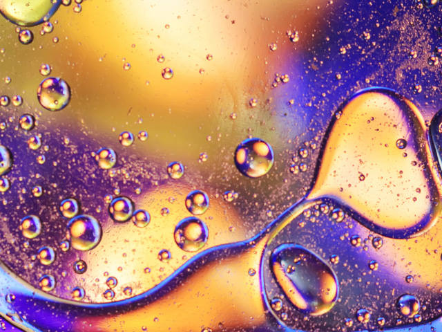 Abstract colorful oil wave on water background