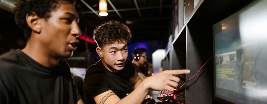 Two men playing videogames