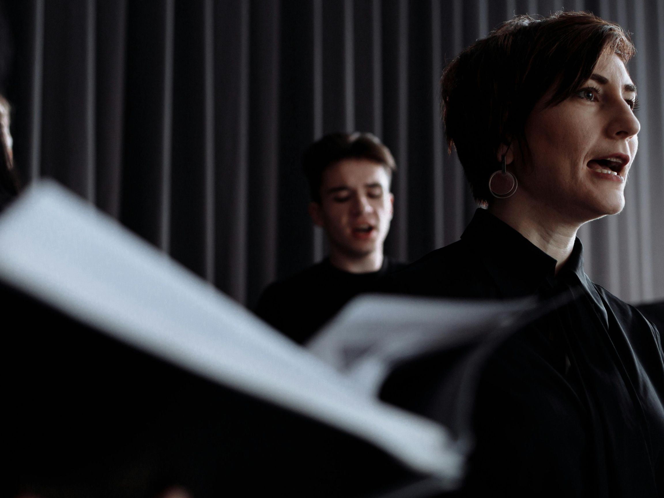 Creative Tensions: Leveraging Interactive Systems to Support Listening, Value Negotiation and Wellbeing in Community Music for Immigrants and Refugees