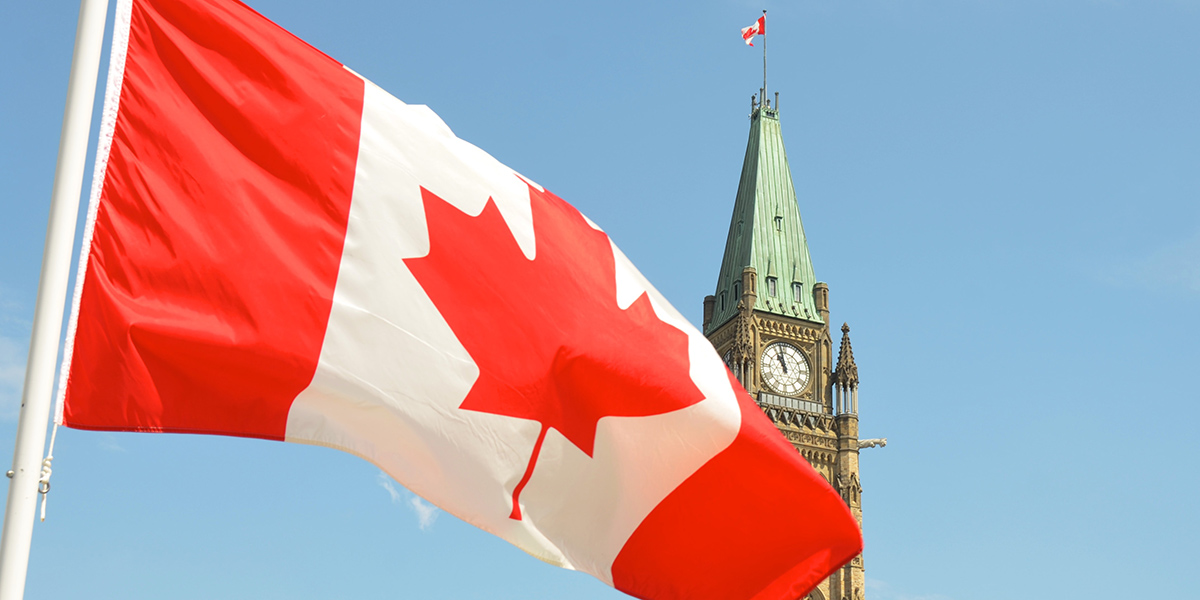 Photo of Canadian Flag and Parliament
